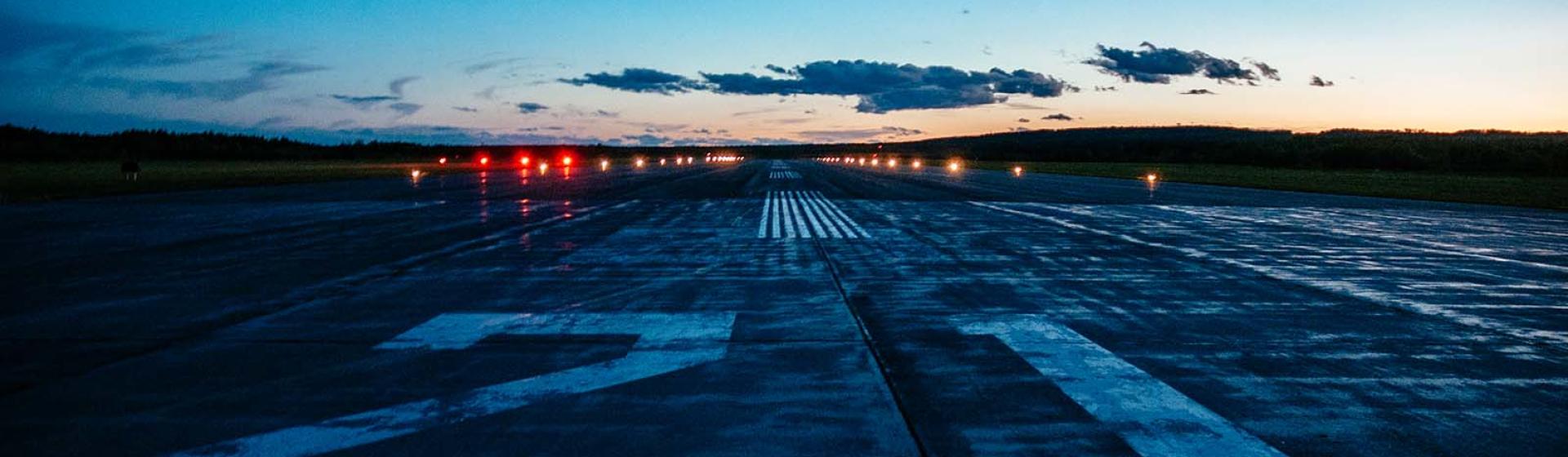 Airport runway at sunset